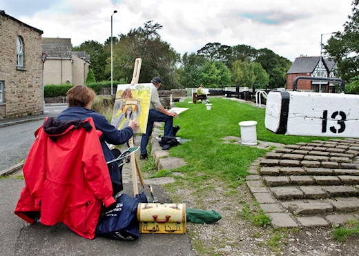 Artists at Lock 13 work on their compositions for an art competion