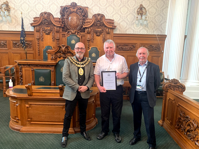 Kevin Murray receives his award from the Mayor of Stockport