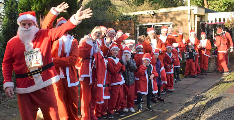 So many Santas waiting for a ride on the Dragon Railway